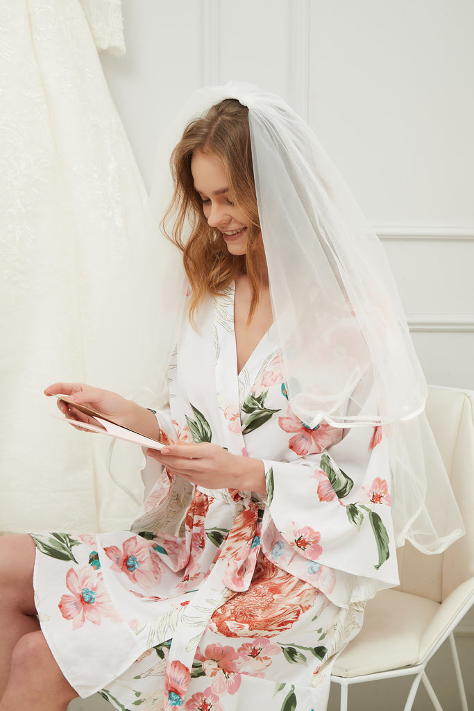Stunning white floral ruffle robe, perfect for the bride and bridesmaids to wear the morning of the wedding.