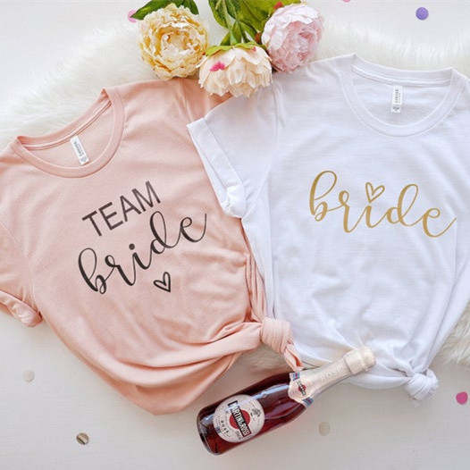 Peach Team Bride T-Shirt. The perfect t-shirt for the bridesmaids the morning of the wedding or even on the hen do!